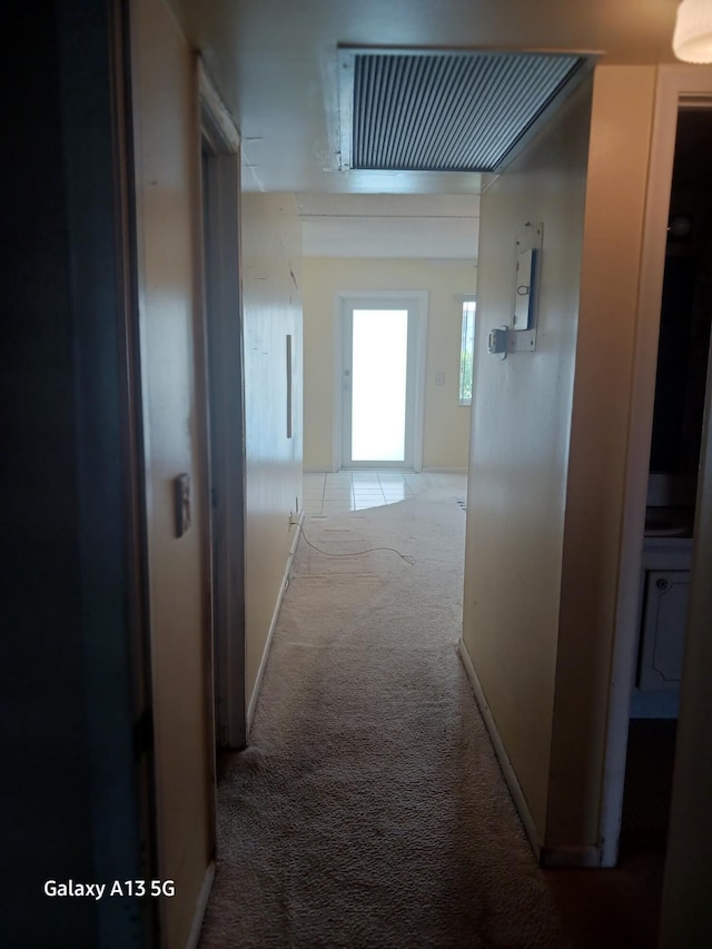 110 Northampton Unit F, West Palm Beach, FL 33417 - hallway featuring baseboards and carpet