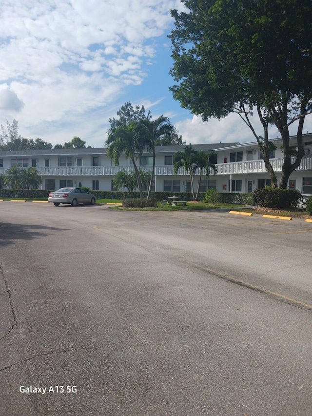 110 Northampton Unit F, West Palm Beach, FL 33417 - view of building exterior featuring uncovered parking