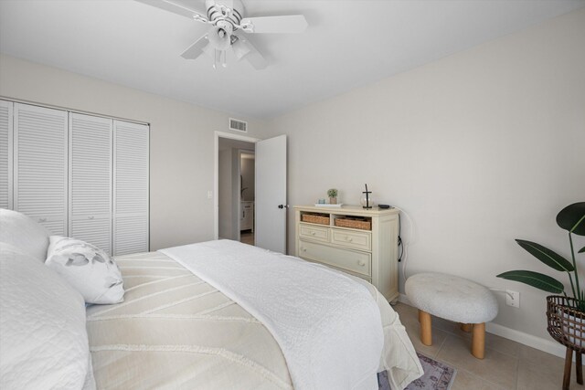 tiled bedroom featuring a closet and ceiling fan