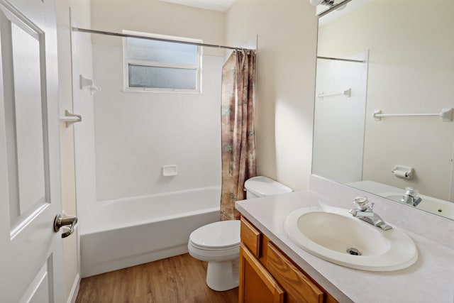 full bathroom with shower / bathtub combination with curtain, toilet, vanity, and hardwood / wood-style flooring