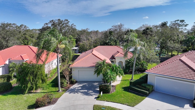 view of front of home with a garage and a front yard