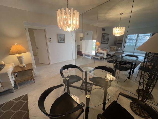 tiled dining space with a chandelier