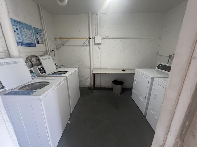 washroom featuring washer and clothes dryer