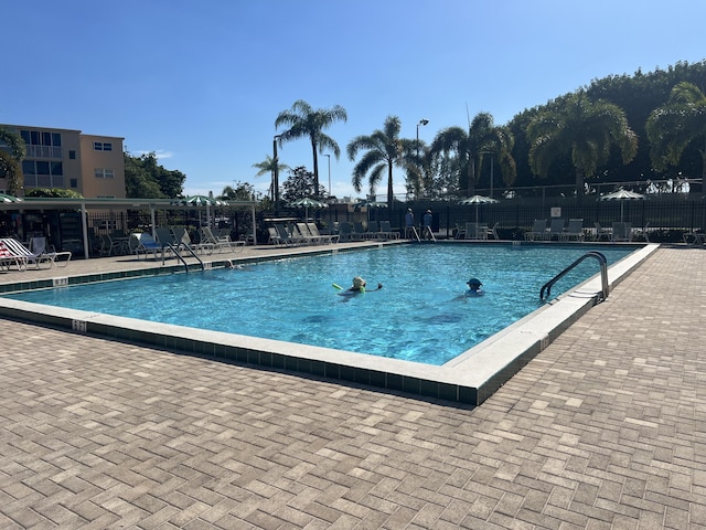 view of swimming pool featuring a patio