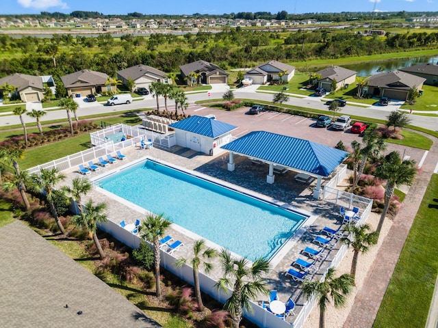 view of swimming pool with a water view