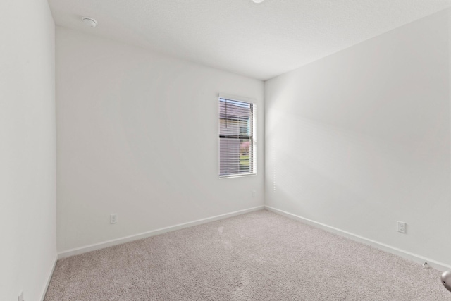 empty room with carpet flooring