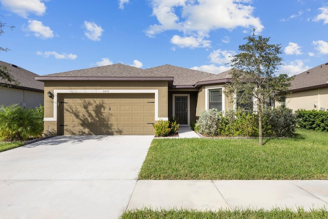 view of front facade featuring a garage and a front yard