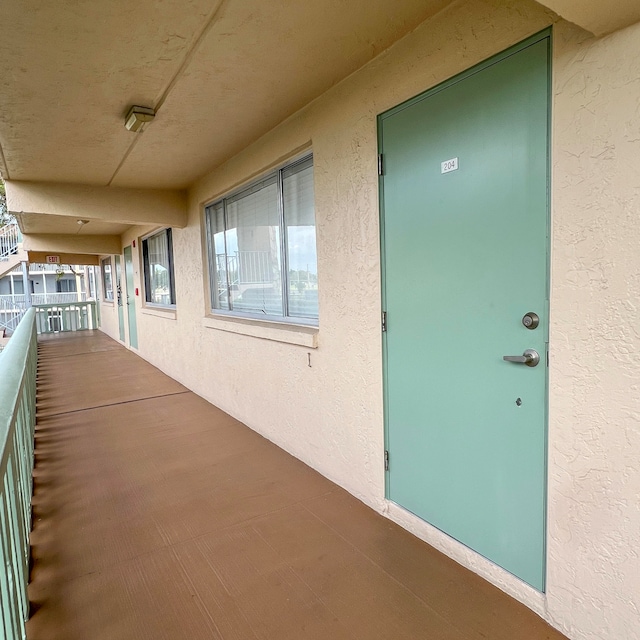 doorway to property featuring a balcony