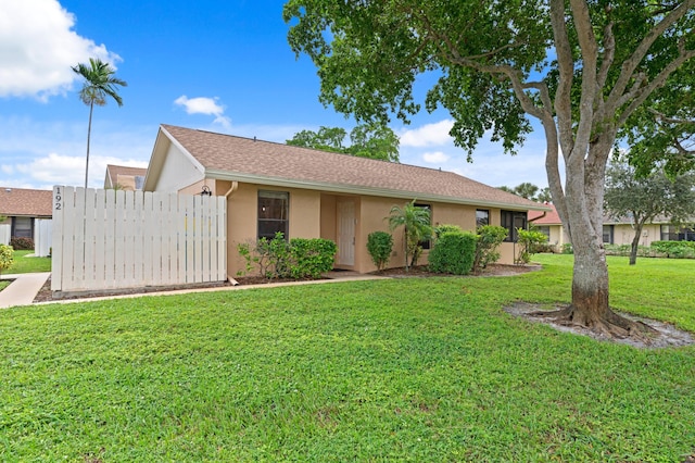 ranch-style house with a front yard