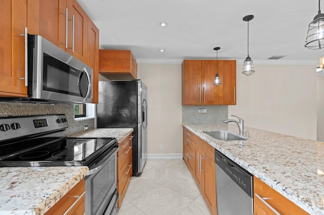 kitchen with decorative light fixtures, tasteful backsplash, stainless steel appliances, and sink