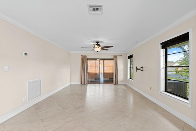 empty room with ornamental molding, a healthy amount of sunlight, and ceiling fan