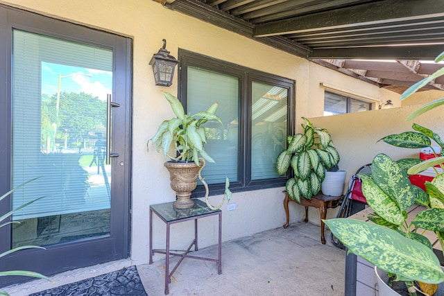 property entrance featuring a patio