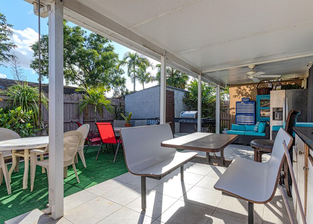 view of patio featuring ceiling fan