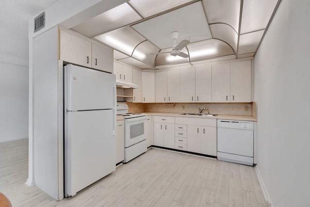 kitchen with white appliances, ceiling fan, sink, light hardwood / wood-style flooring, and white cabinetry