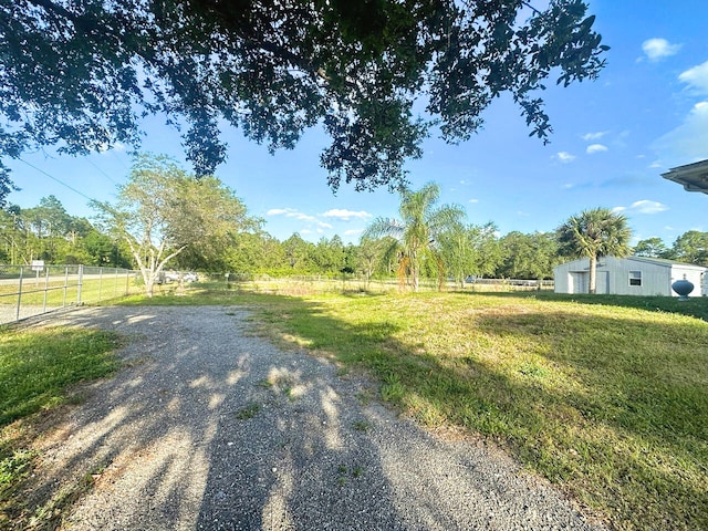 view of yard with a rural view