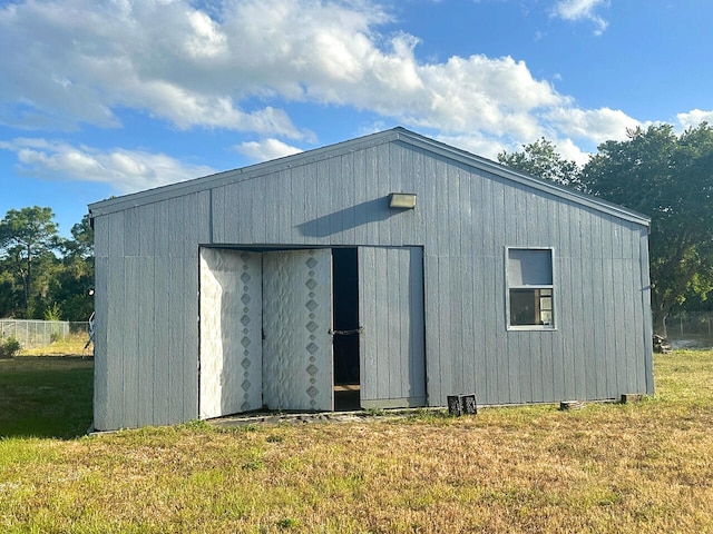 view of outdoor structure with a yard