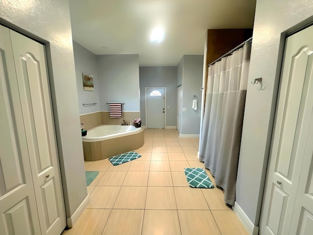 bathroom with tile patterned floors and separate shower and tub