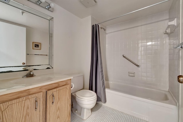 full bathroom featuring tile patterned flooring, vanity, shower / tub combo, and toilet