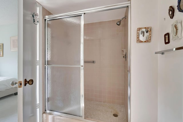 bathroom featuring an enclosed shower