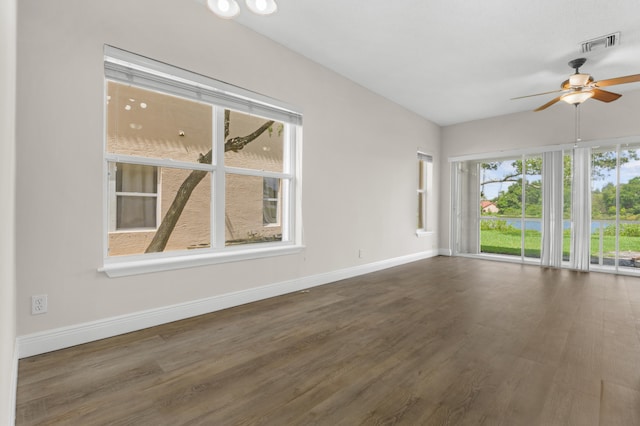 spare room featuring dark hardwood / wood-style floors and ceiling fan