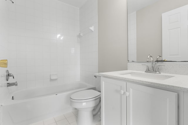 full bathroom with toilet, tiled shower / bath combo, vanity, and tile patterned floors