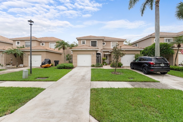 mediterranean / spanish house with a front lawn and a garage