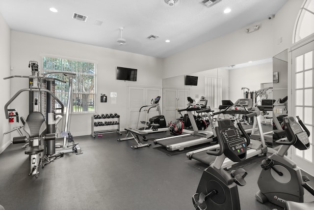 gym with a textured ceiling