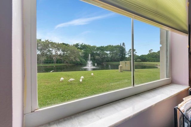 interior space with a healthy amount of sunlight and a water view