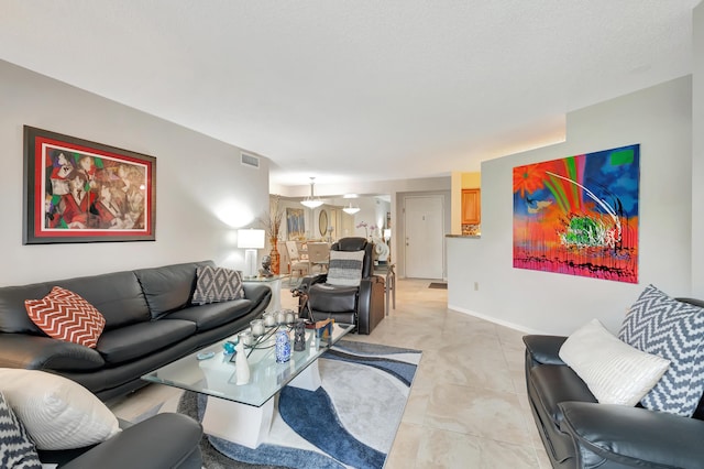 living room featuring a textured ceiling