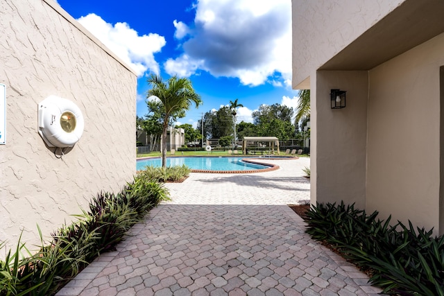 view of pool featuring a patio