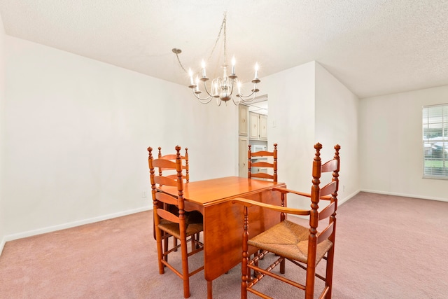 carpeted dining space featuring a textured ceiling and a chandelier