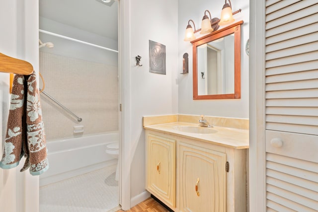 full bathroom featuring vanity, toilet, and tiled shower / bath