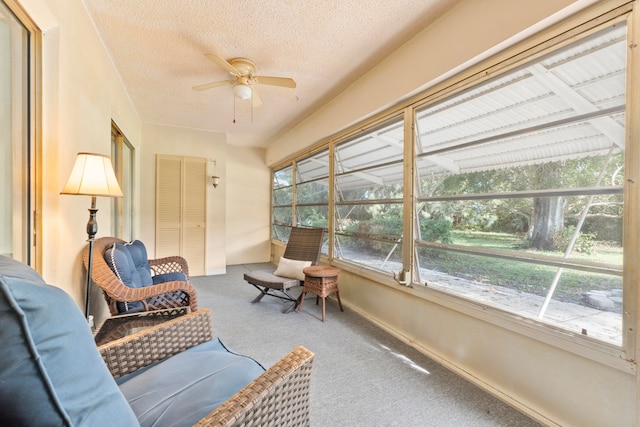 sunroom featuring ceiling fan