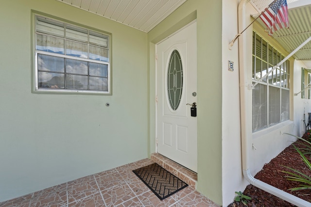 doorway to property featuring covered porch