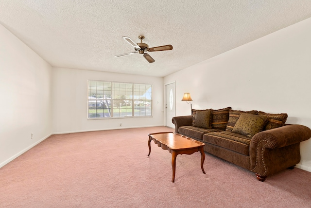 carpeted living room with a textured ceiling and ceiling fan