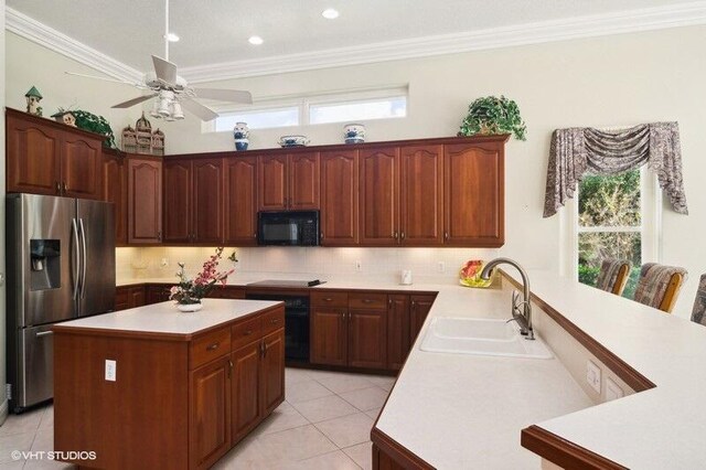 kitchen featuring black appliances, sink, kitchen peninsula, crown molding, and light tile patterned floors