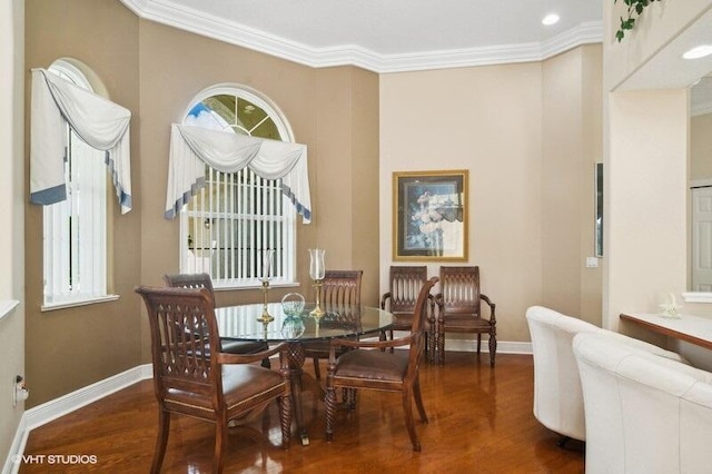 dining area with crown molding and dark wood-type flooring