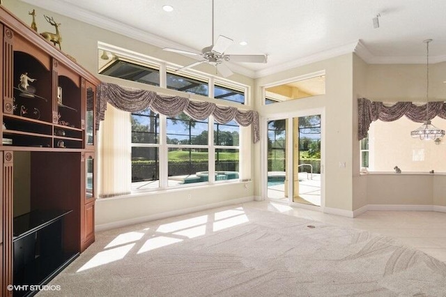 unfurnished sunroom with ceiling fan