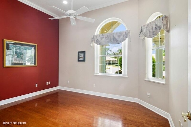 spare room featuring hardwood / wood-style floors, crown molding, and ceiling fan