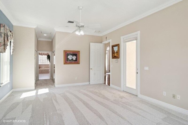 carpeted empty room featuring ceiling fan and ornamental molding