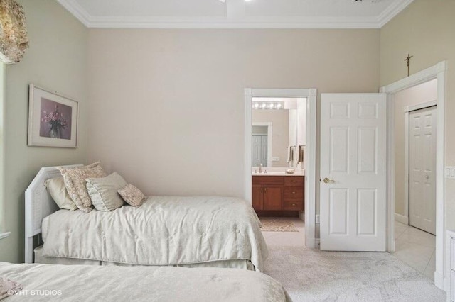 bedroom featuring connected bathroom, light carpet, and ornamental molding