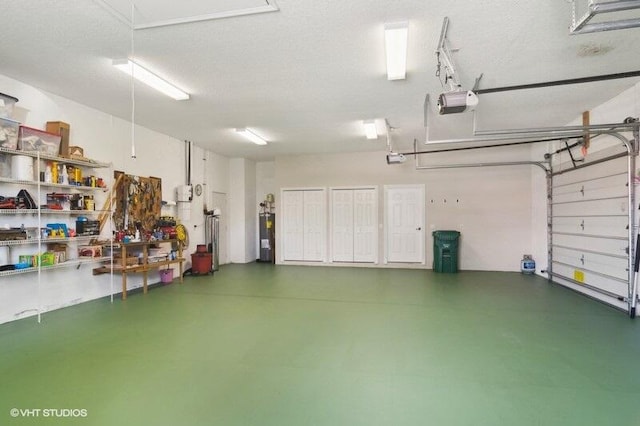 garage with a garage door opener and water heater