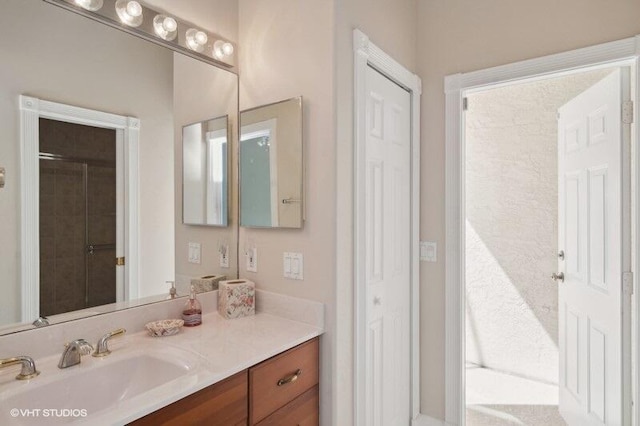 bathroom with vanity and walk in shower