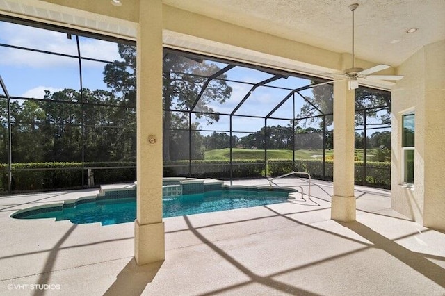 view of pool featuring a patio area, glass enclosure, and ceiling fan