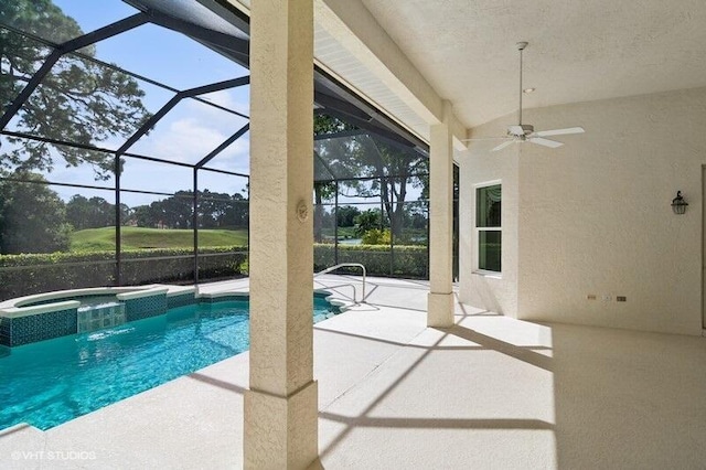 view of pool with a patio, a lanai, an in ground hot tub, and ceiling fan