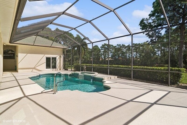 view of pool with a patio area and a lanai