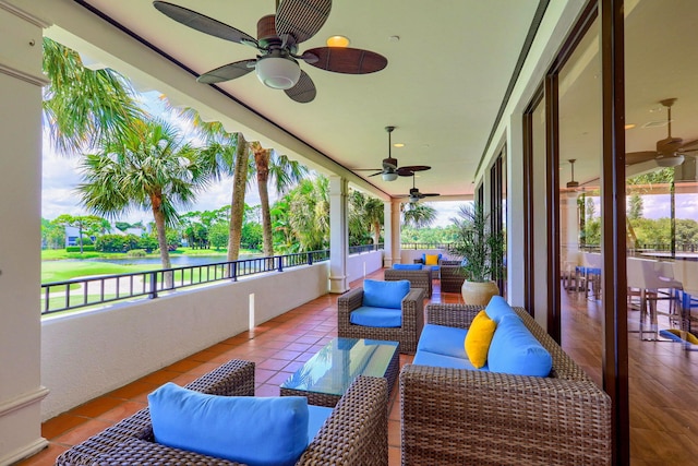 sunroom with ceiling fan and a healthy amount of sunlight