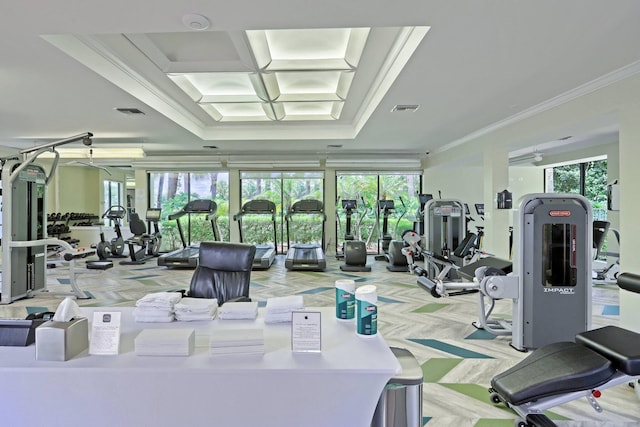 workout area featuring ornamental molding