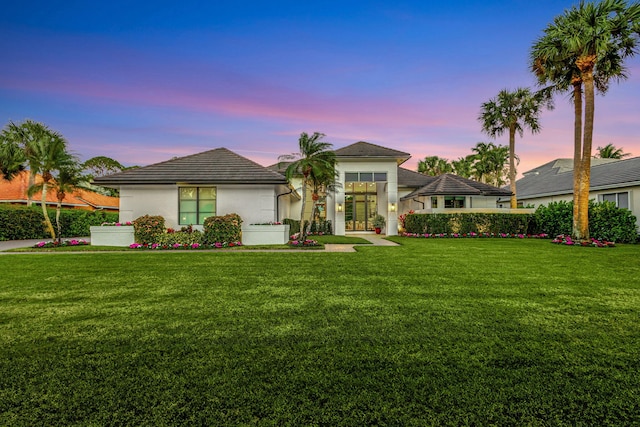 view of front of property with a yard