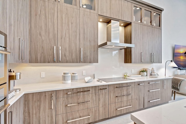 kitchen with black electric stovetop and wall chimney exhaust hood